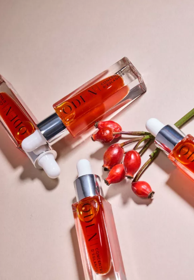 4 bottles of ODEN rosehip collagen anti-aging oil on berrys.