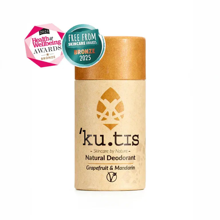 Kutis natural deodorant with awards on a white background, lid on, front, yellow cap.