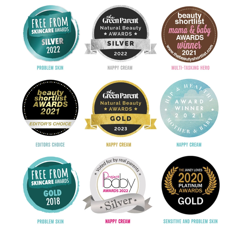 Collection of awards and badges for skincare and baby products on a white background