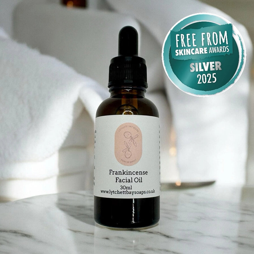 lytchett bay soaps Bottle of frankincense facial oil with a dropper on a marble surface, featuring a 'Free from Skincare Awards Silver 2025' badge.