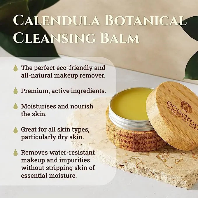 ecodrop Calendula botanical cleansing balm with wooden lid on a stone surface, surrounded by green leaves.