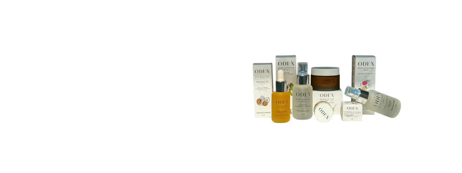 ODEN skincare product clear bottle with yellow oil and white box. On a white background