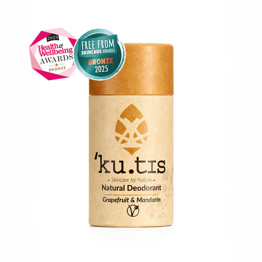 Kutis natural deodorant with awards on a white background, lid on, front, yellow cap.