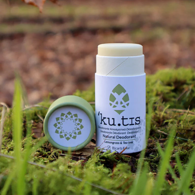 Kutis Lemongrass & Teatree Bicarb Free Natural Deodorant, lid off on grassy background