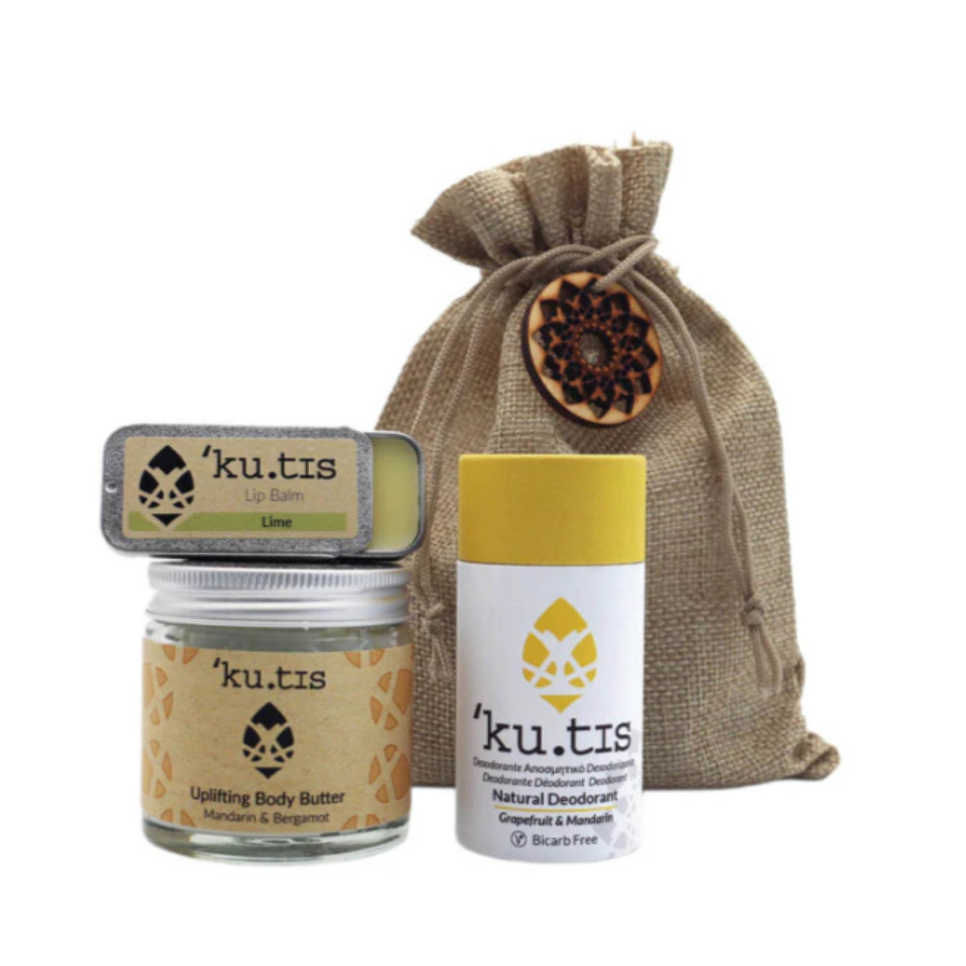 Kutis skincare products including lip balm, body butter, and deodorant with a drawstring bag on a white background.