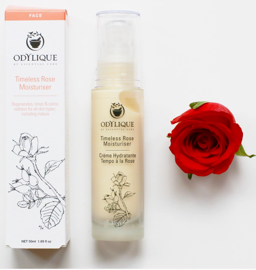 Odylique Timeless Rose Moisturizer with packaging and a red rose on a white background